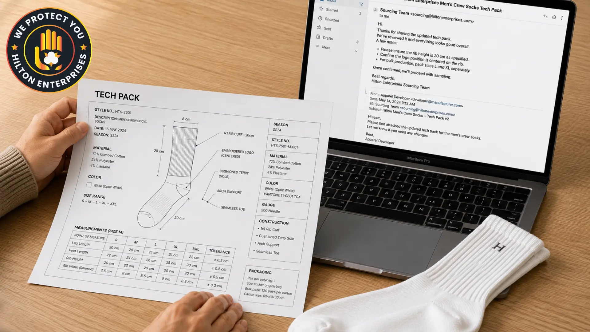 A brand founder sitting at a minimal clean desk reviewing a private label white sock sample alongside a tech pack specification sheet and an open laptop, representing the private label sock launch process