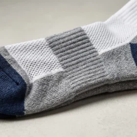 Performance synthetic athletic sock material with moisture-wicking knit